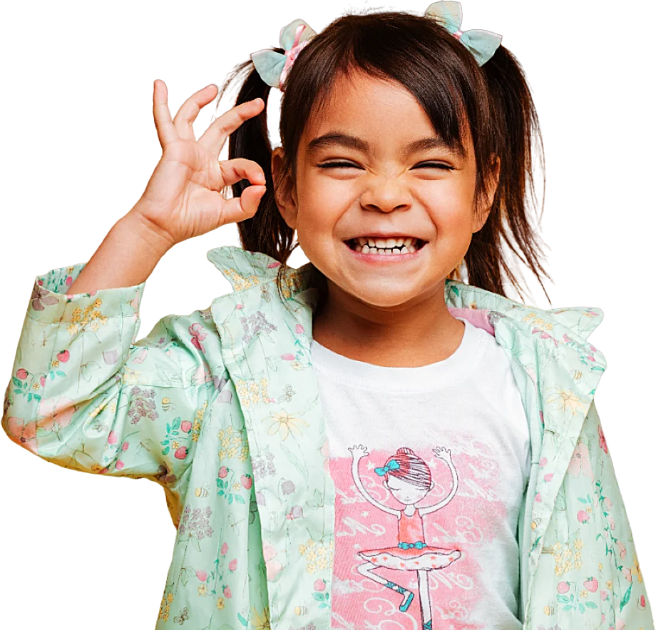 Smiling child giving an OK sign