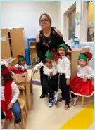 A teacher with children in the classroom