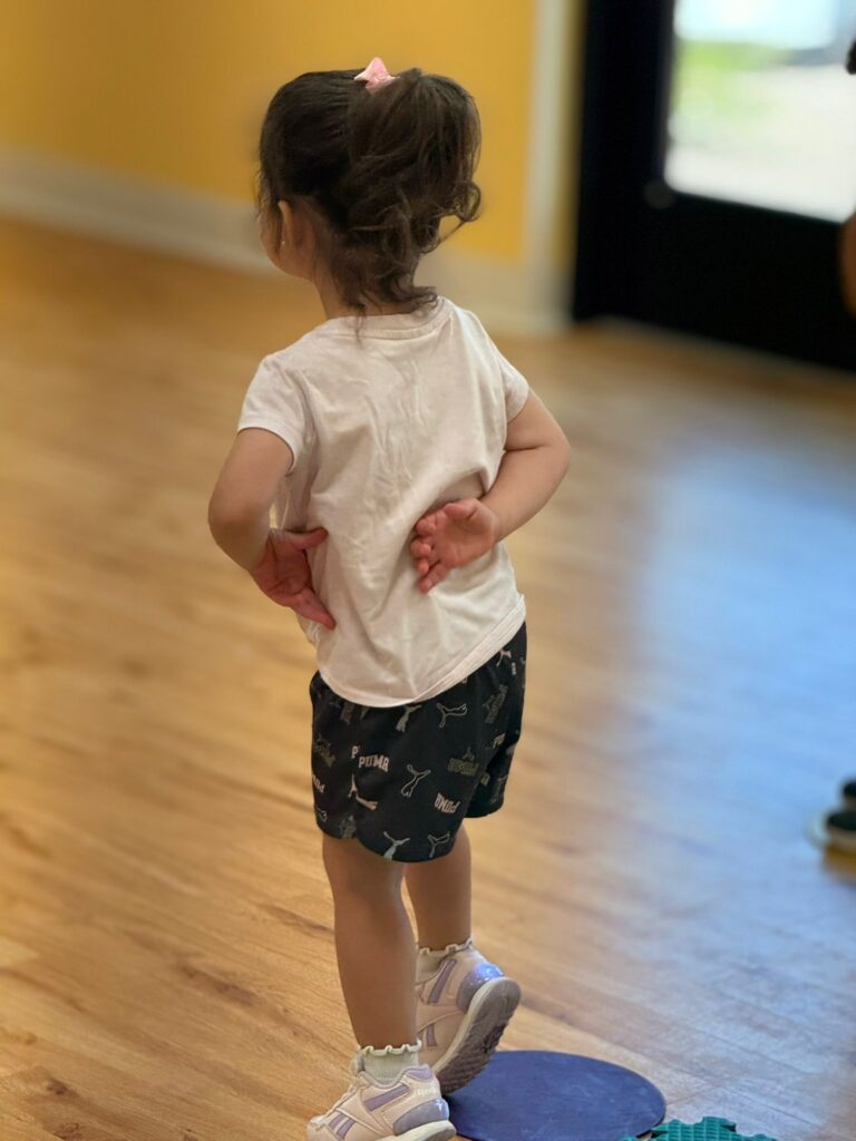A toddler at play in the PRE CASA classroom